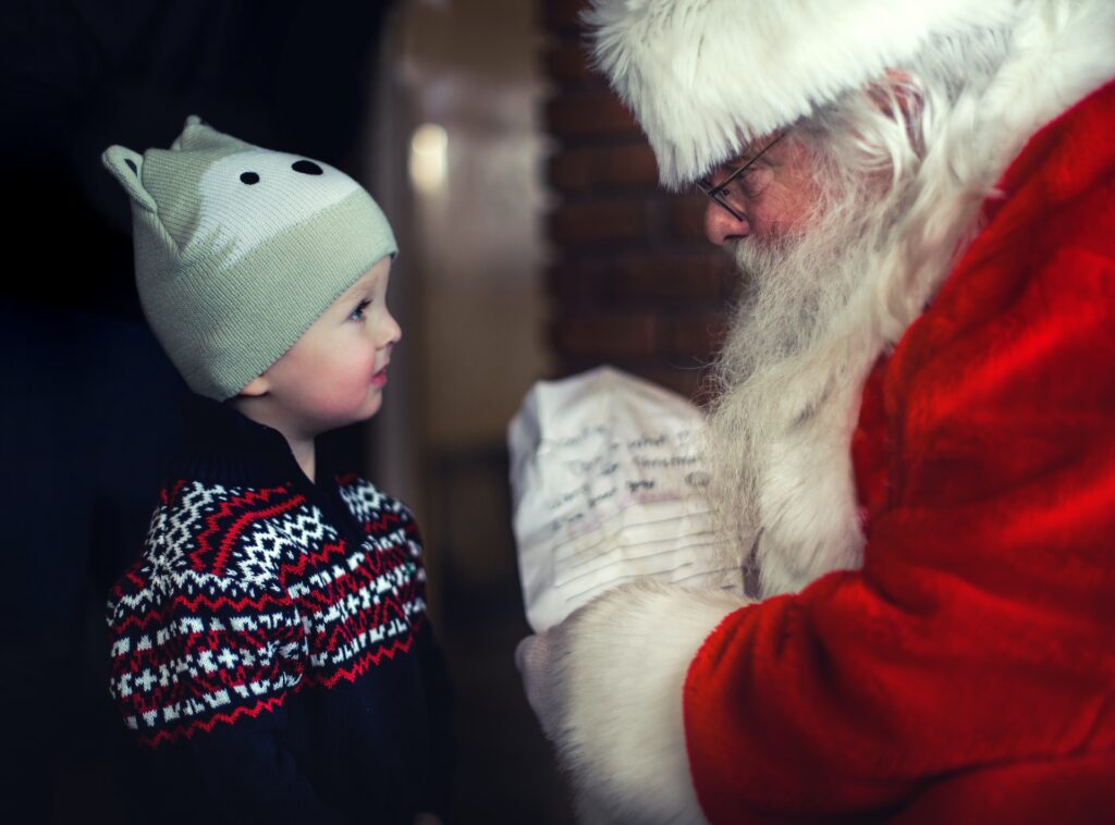 Modern Santa talking to a child